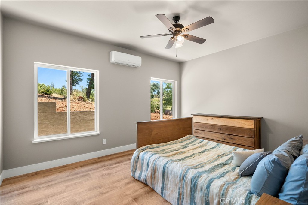 5334 Filbert Street Paradise, CA 95969 - Photo 16 of 30 a bedroom with a large bed and a window