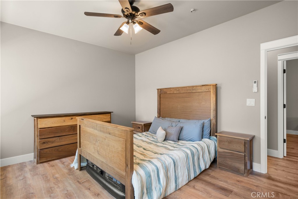 5334 Filbert Street Paradise, CA 95969 - Photo 17 of 30 a bedroom with bed and wooden floor