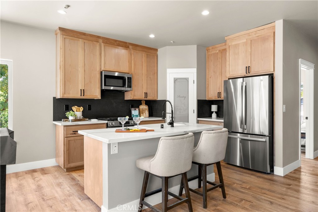 5334 Filbert Street Paradise, CA 95969 - Photo 8 of 30 a kitchen with stainless steel appliances a refrigerator stove microwave and cabinets
