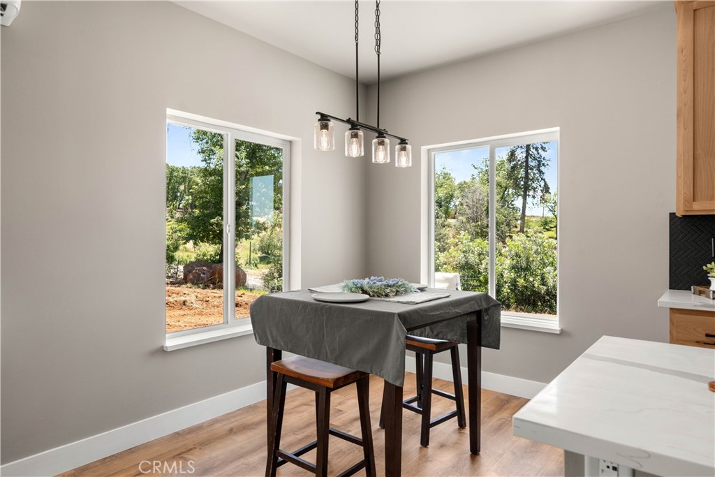 5334 Filbert Street Paradise, CA 95969 - Photo 9 of 30 a dining room with furniture window wooden floor