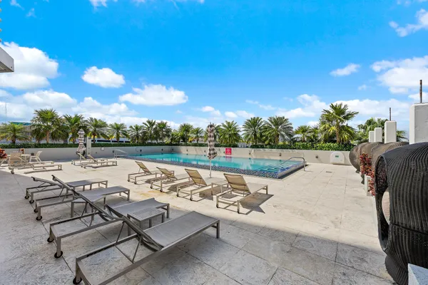 a view of a swimming pool with an outdoor space