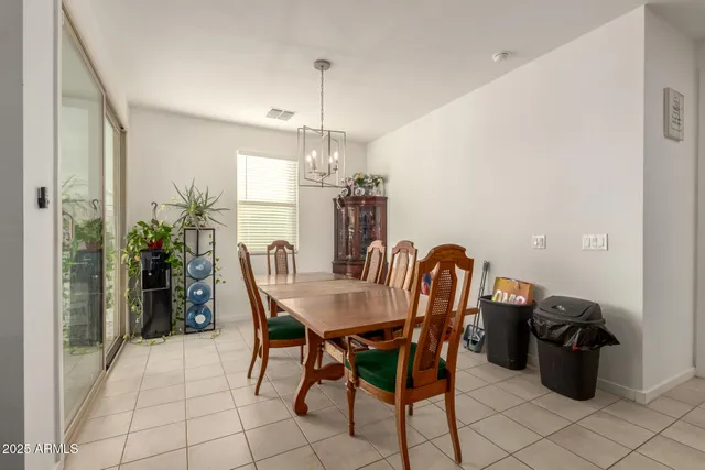 a view of a dining room with furniture and window