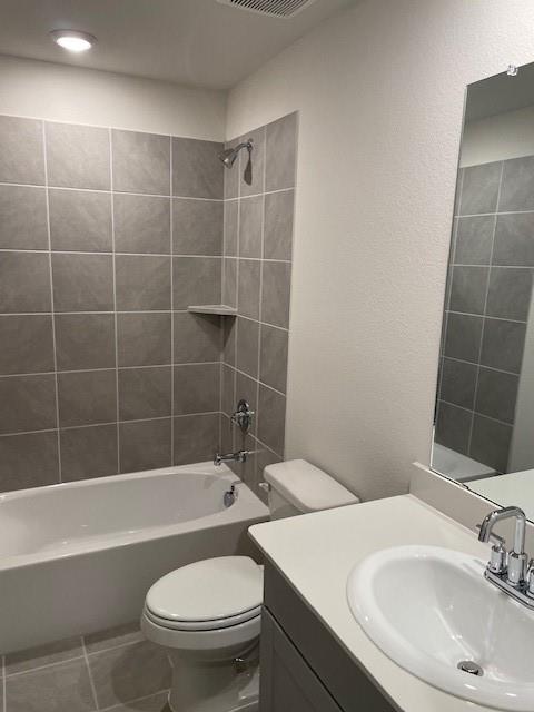 3116 Kingsgarden Road Denton, TX 76207 - Photo 11 of 20 a bathroom with a sink a toilet and bathtub