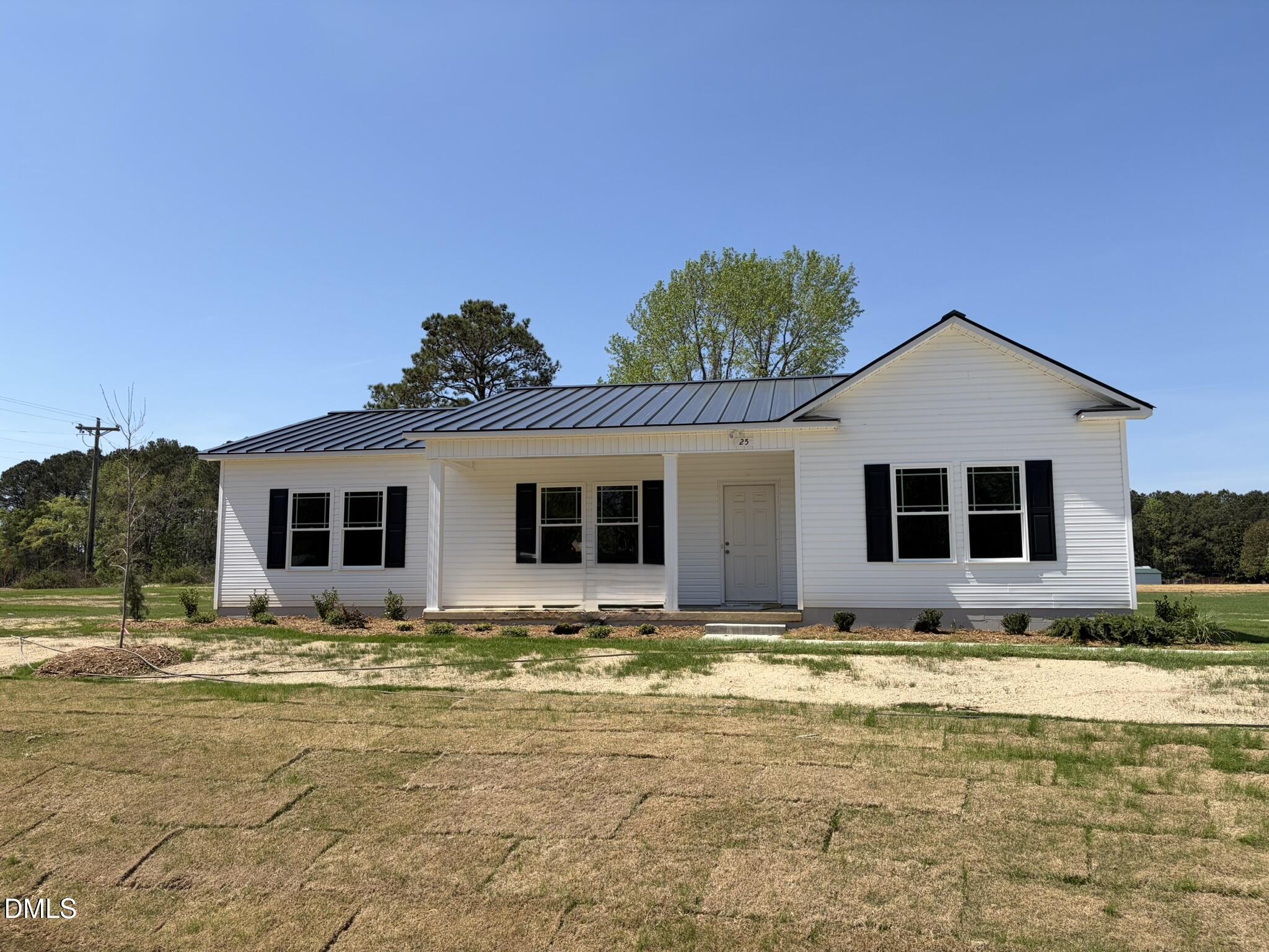 25 Jacobs Ridge Drive Four Oaks, NC 27524 - Photo 1 of 18 a house with swimming pool in front of it
