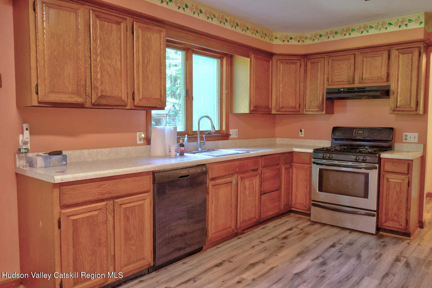 70 Horseneck Road Freehold, NY 12431 - Photo 8 of 70 a kitchen with a sink stove and cabinets