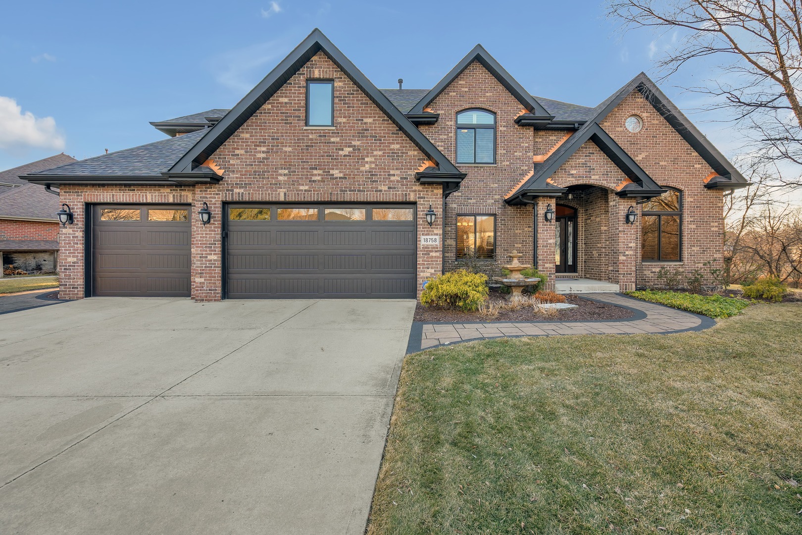 18758 Chestnut Court Mokena, IL 60448 - Photo 1 of 1 a front view of a house with a yard and garage