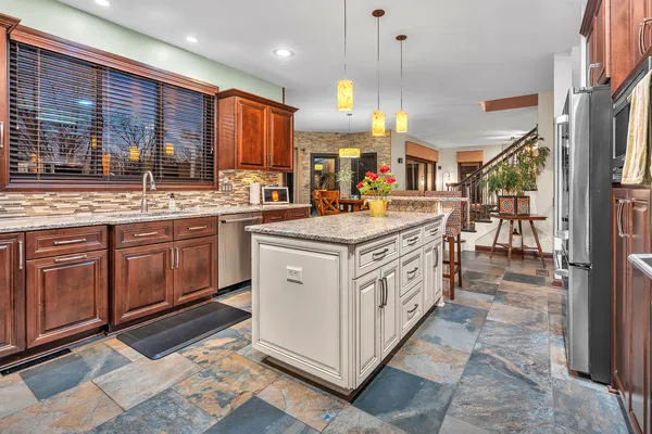 a kitchen with a stove top oven sink and cabinets