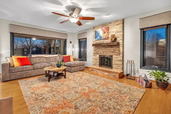 a living room with furniture fireplace and flat screen tv