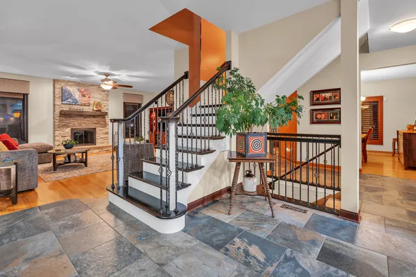a view of entryway dining room and hall with wooden floor