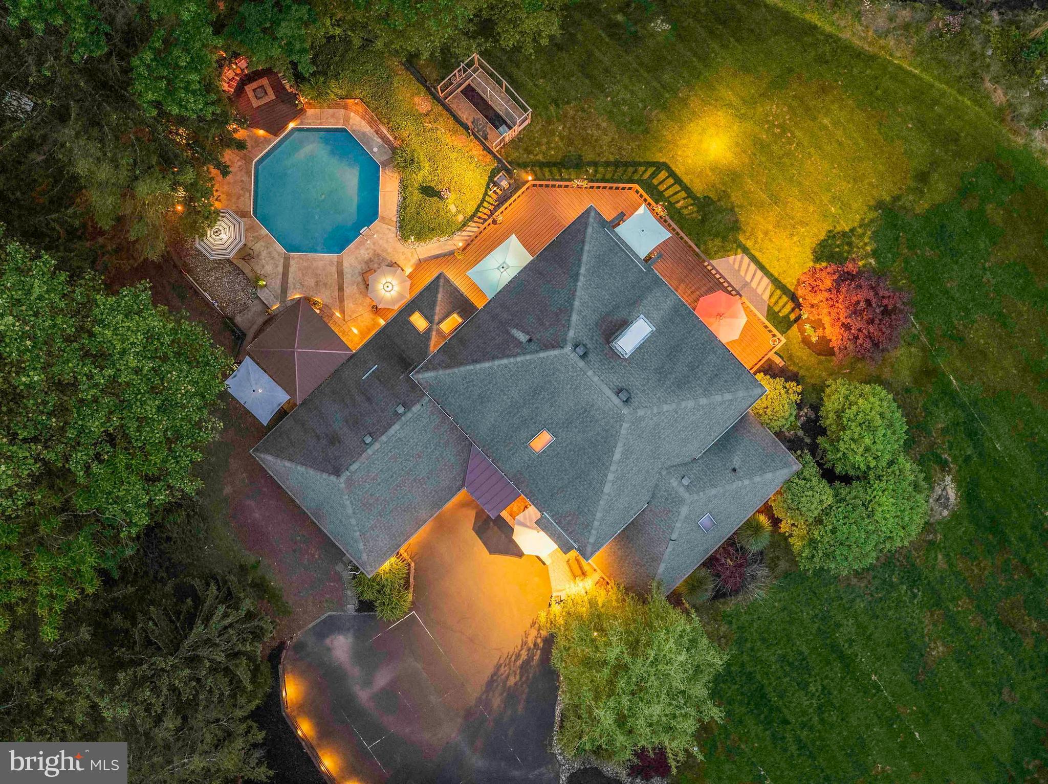 3097 Mill Road Doylestown, PA 18902 - Photo 102 of 115 an aerial view of a house with swimming pool and large trees