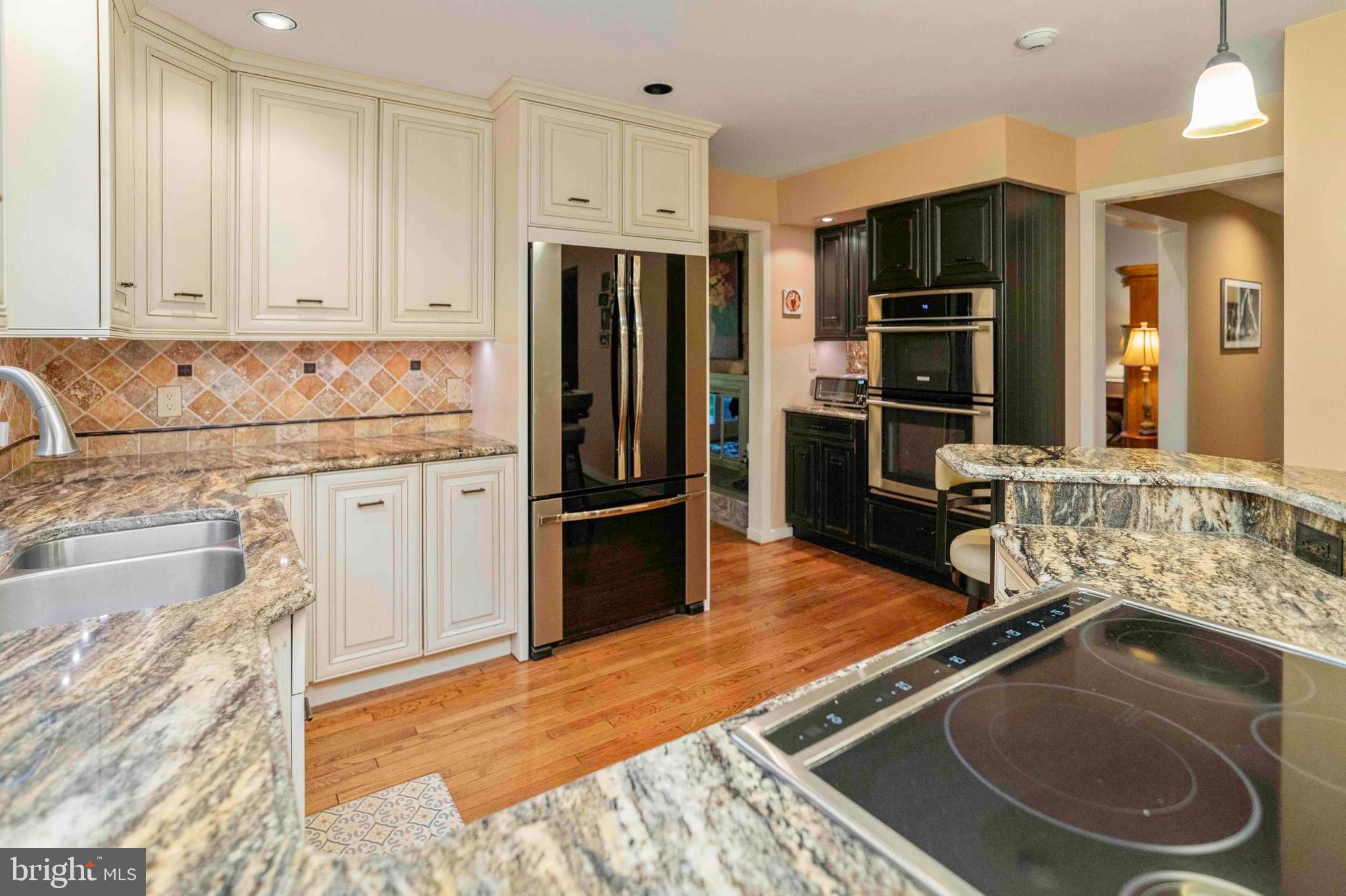 3097 Mill Road Doylestown, PA 18902 - Photo 14 of 115 a kitchen with stainless steel appliances granite countertop a sink stove and refrigerator