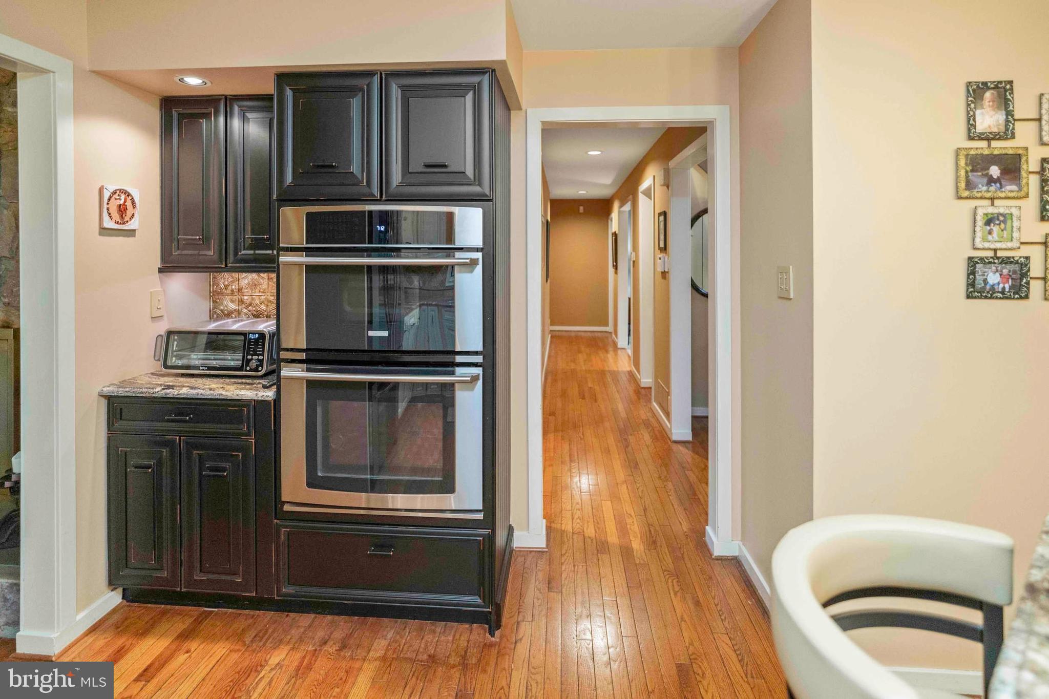 3097 Mill Road Doylestown, PA 18902 - Photo 16 of 115 a kitchen with kitchen island wooden cabinets and stainless steel appliances