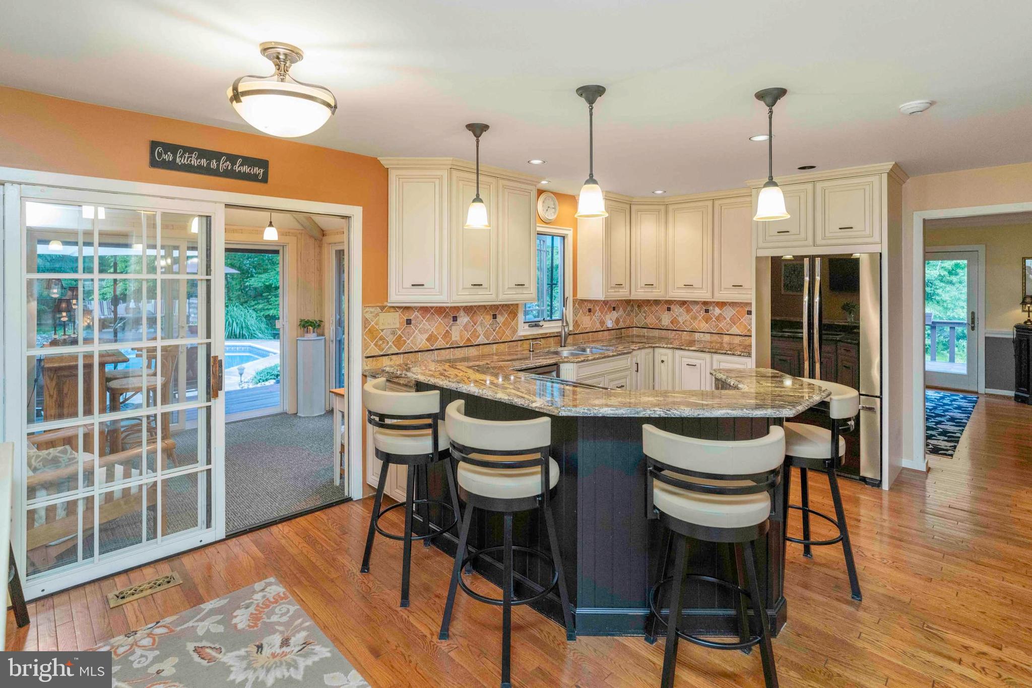 3097 Mill Road Doylestown, PA 18902 - Photo 19 of 115 a dining table with chairs and wooden floor