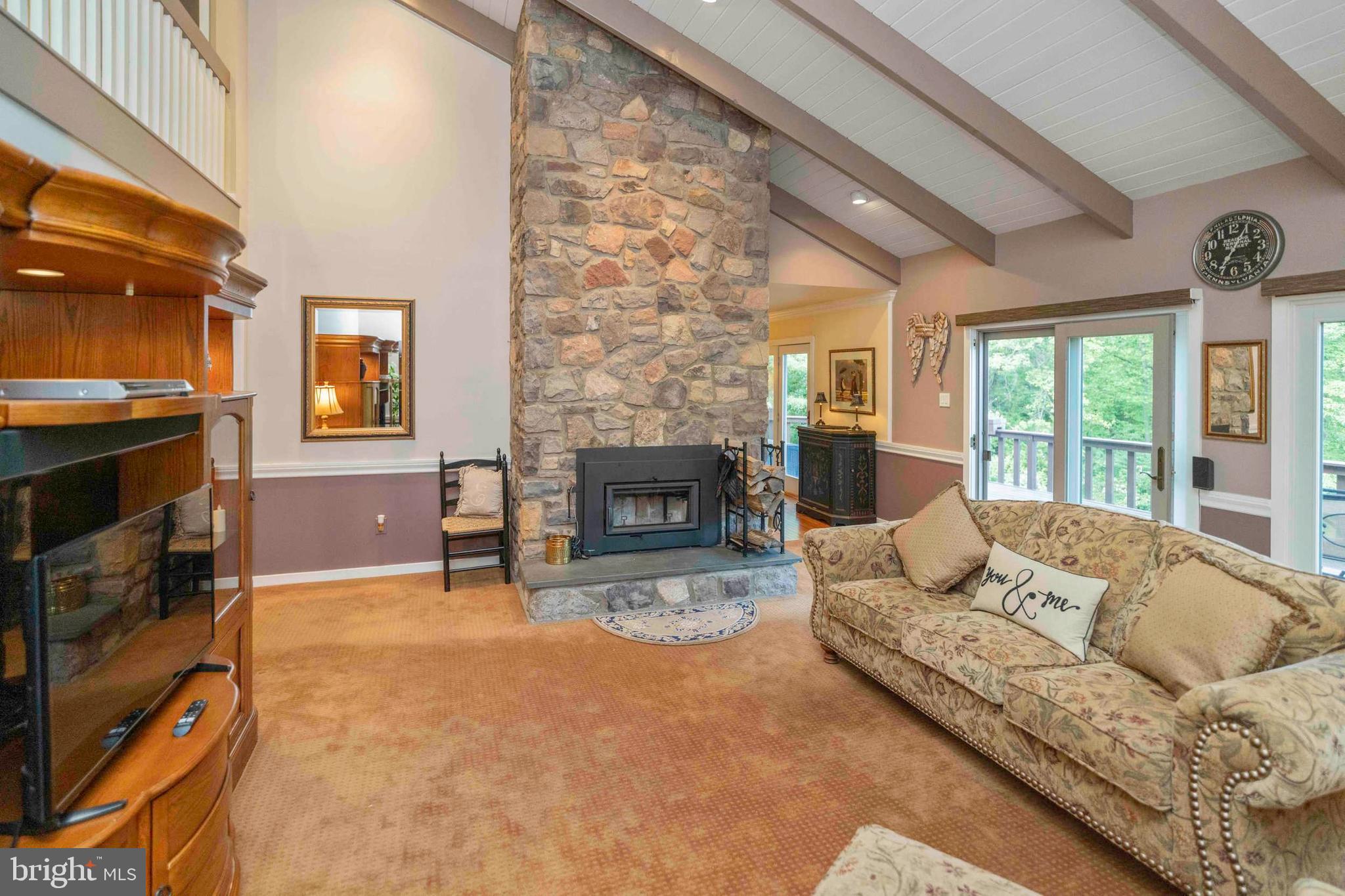 3097 Mill Road Doylestown, PA 18902 - Photo 24 of 115 a living room with furniture and a fireplace