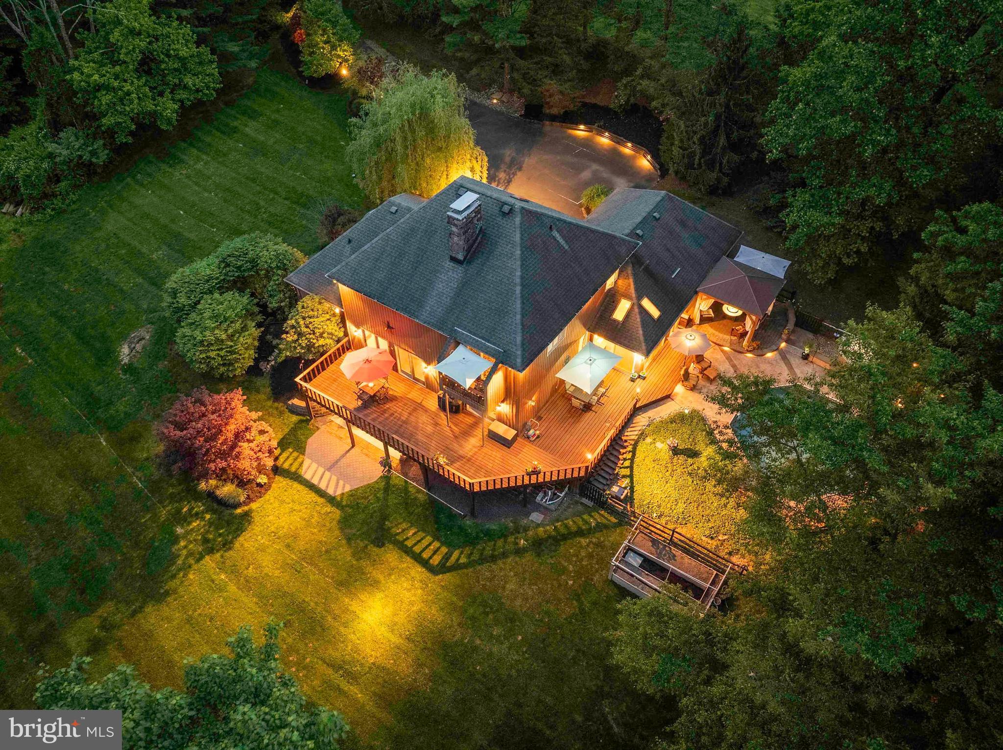 3097 Mill Road Doylestown, PA 18902 - Photo 4 of 115 an aerial view of a house with swimming pool outdoor seating and yard