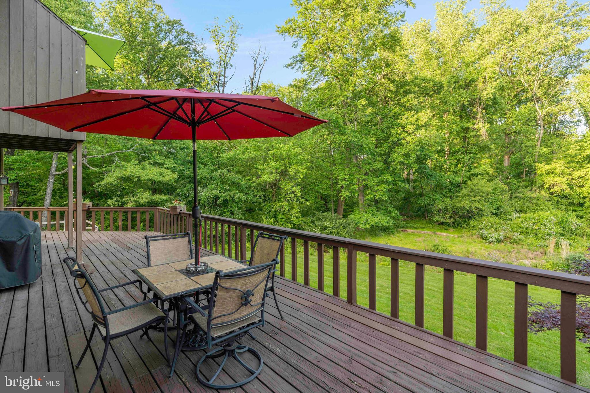 3097 Mill Road Doylestown, PA 18902 - Photo 95 of 115 a view of balcony with furniture and umbrella