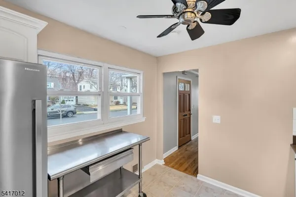 a view of a hallway with a chandelier