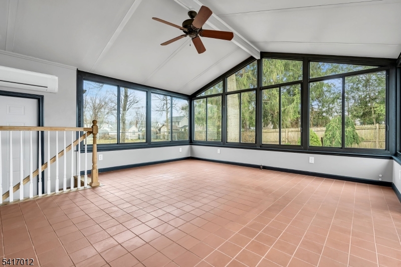 823 Pinewood Road Union, NJ 07083 - Photo 10 of 28 wooden floor in an empty room with a window