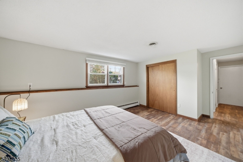 11 Deerfield Road Parsippany, NJ 07054 - Photo 33 of 42 a bedroom with a bed and a window
