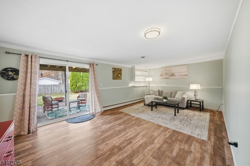 11 Deerfield Road Parsippany, NJ 07054 - Photo 35 of 42 a living room with furniture and a table