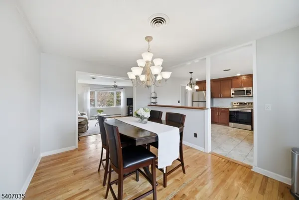 a kitchen with stainless steel appliances kitchen island granite countertop a sink and cabinets