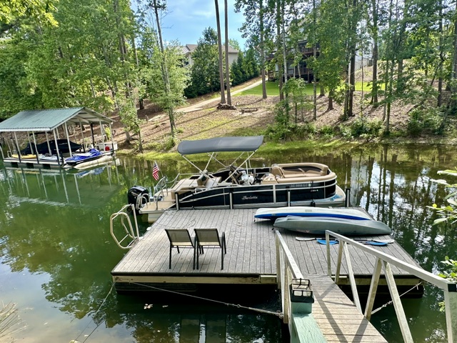 206 Petty Road Seneca, SC 29672 - Photo 3 of 47 A tranquil lakefront setting offers an expansive private dock with ample space for watercraft.