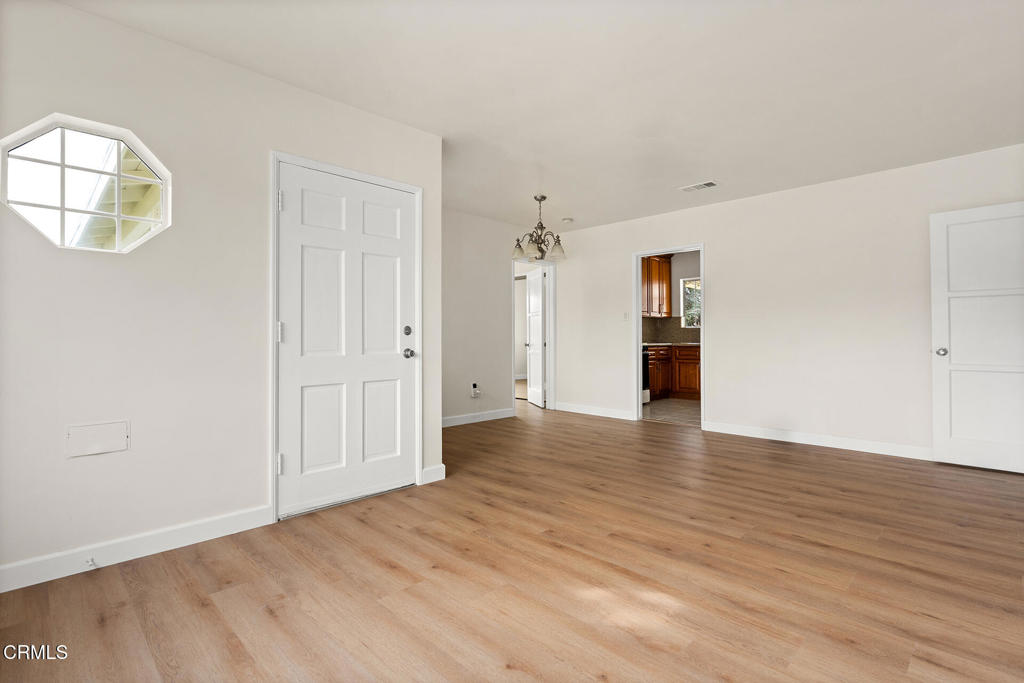 3943 Rio Hondo Avenue Rosemead, CA 91770 - Photo 2 of 9 an empty room with wooden floor and windows