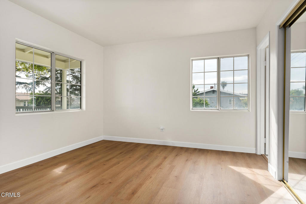 3943 Rio Hondo Avenue Rosemead, CA 91770 - Photo 4 of 9 a view of an empty room with wooden floor and a window