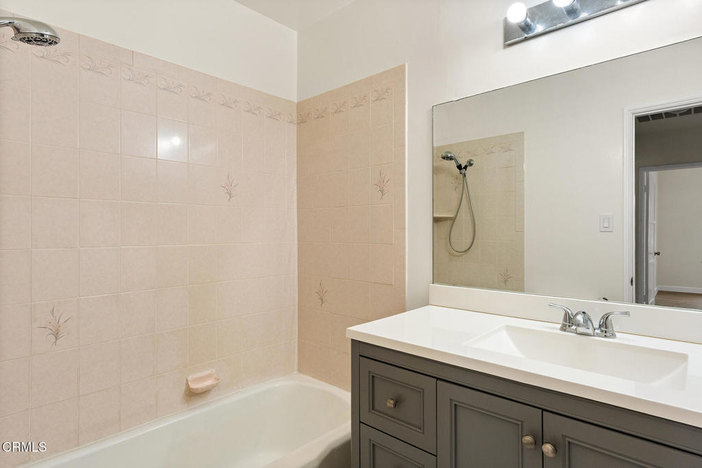 3943 Rio Hondo Avenue Rosemead, CA 91770 - Photo 6 of 9 a bathroom with a granite countertop sink a mirror and a bathtub