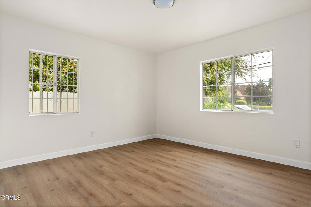 3943 Rio Hondo Avenue Rosemead, CA 91770 - Photo 7 of 9 an empty room with wooden floor and windows