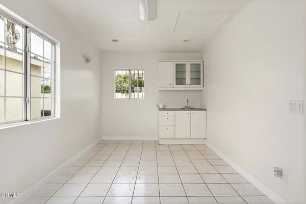 a view of an empty room with windows