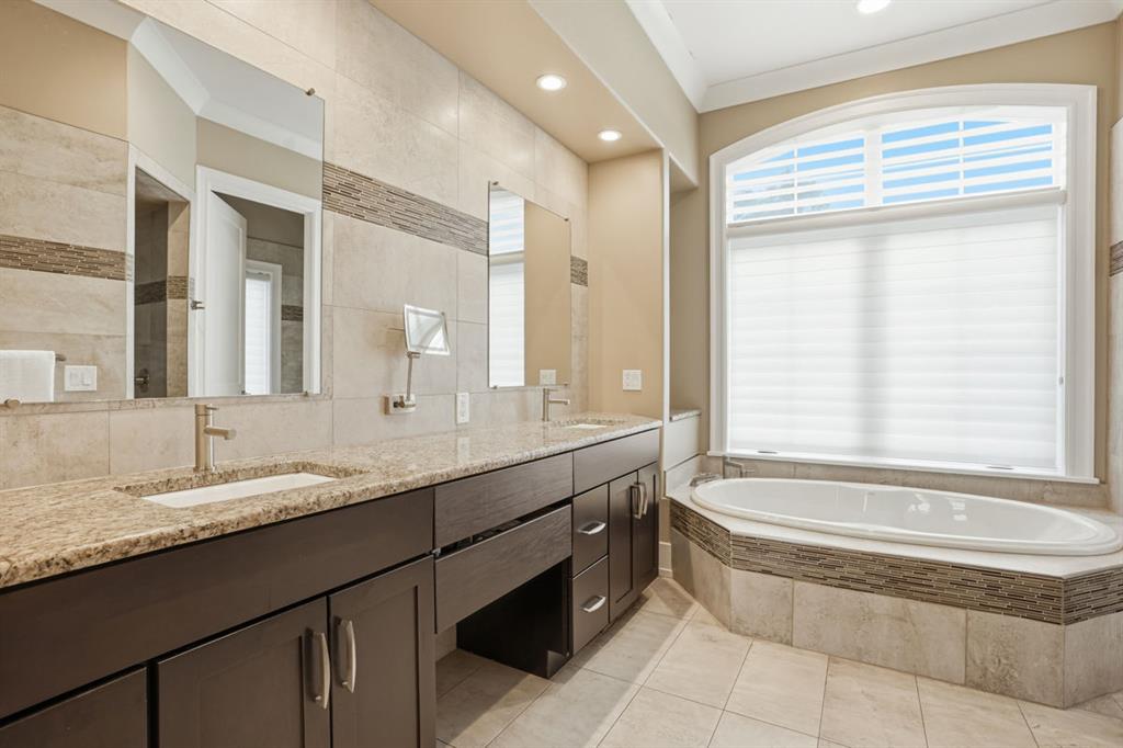 931 Pleasant Hill Road Wexford, PA 15090 - Photo 26 of 50 a bathroom with a granite countertop tub sink and mirror