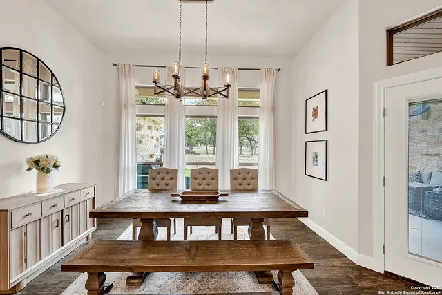 a view of a dining room with furniture window and wooden floor