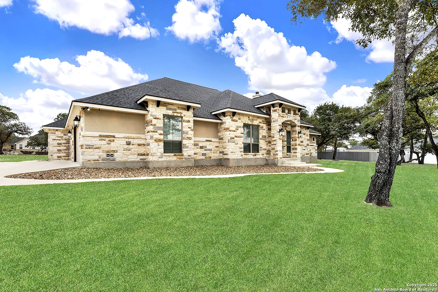 173 Hidden Pond Adkins, TX 78101 - Photo 2 of 40 a view of a house with a yard