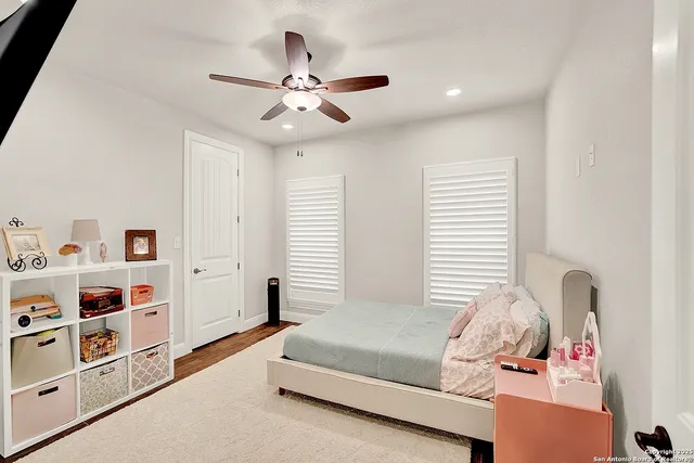 a bedroom with furniture and a window
