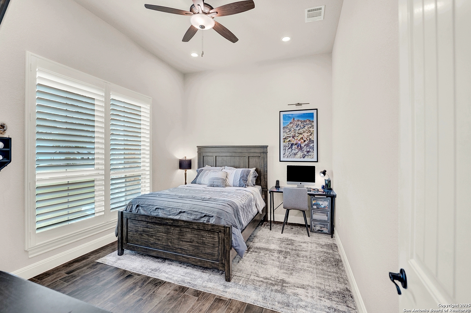 173 Hidden Pond Adkins, TX 78101 - Photo 24 of 40 a bedroom with a bed and ceiling fan