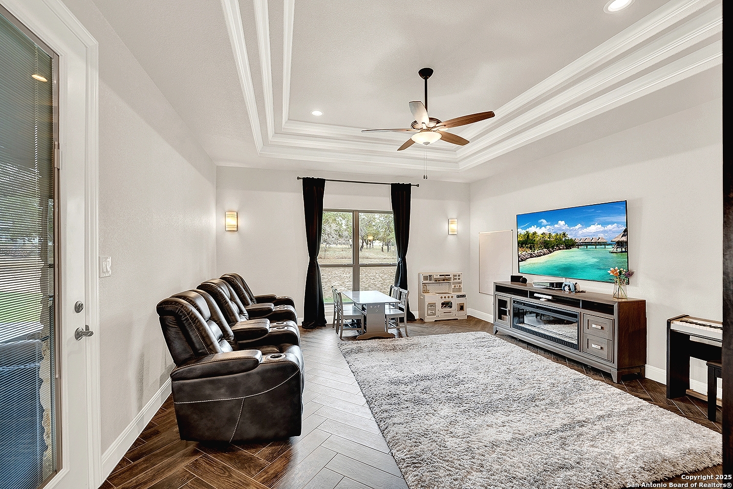 173 Hidden Pond Adkins, TX 78101 - Photo 27 of 40 a living room with furniture and a flat screen tv