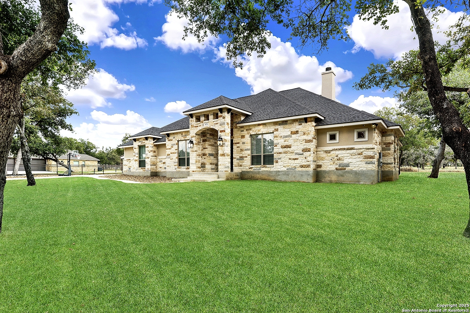 173 Hidden Pond Adkins, TX 78101 - Photo 3 of 40 a view of a house with a yard