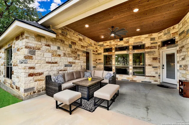 a outdoor space with patio furniture and potted plants