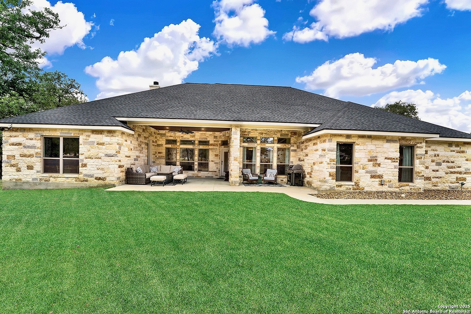 173 Hidden Pond Adkins, TX 78101 - Photo 34 of 40 a view of a house with backyard porch and patio
