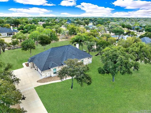 a view of a garden with a building in the background