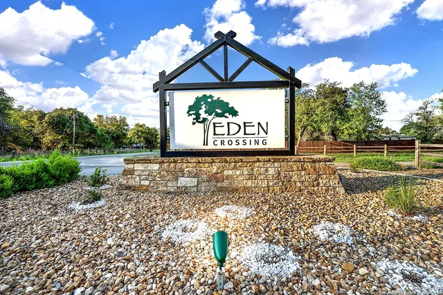 a view of a pathway with a wrought fence