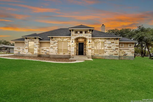 a front view of a house with a yard