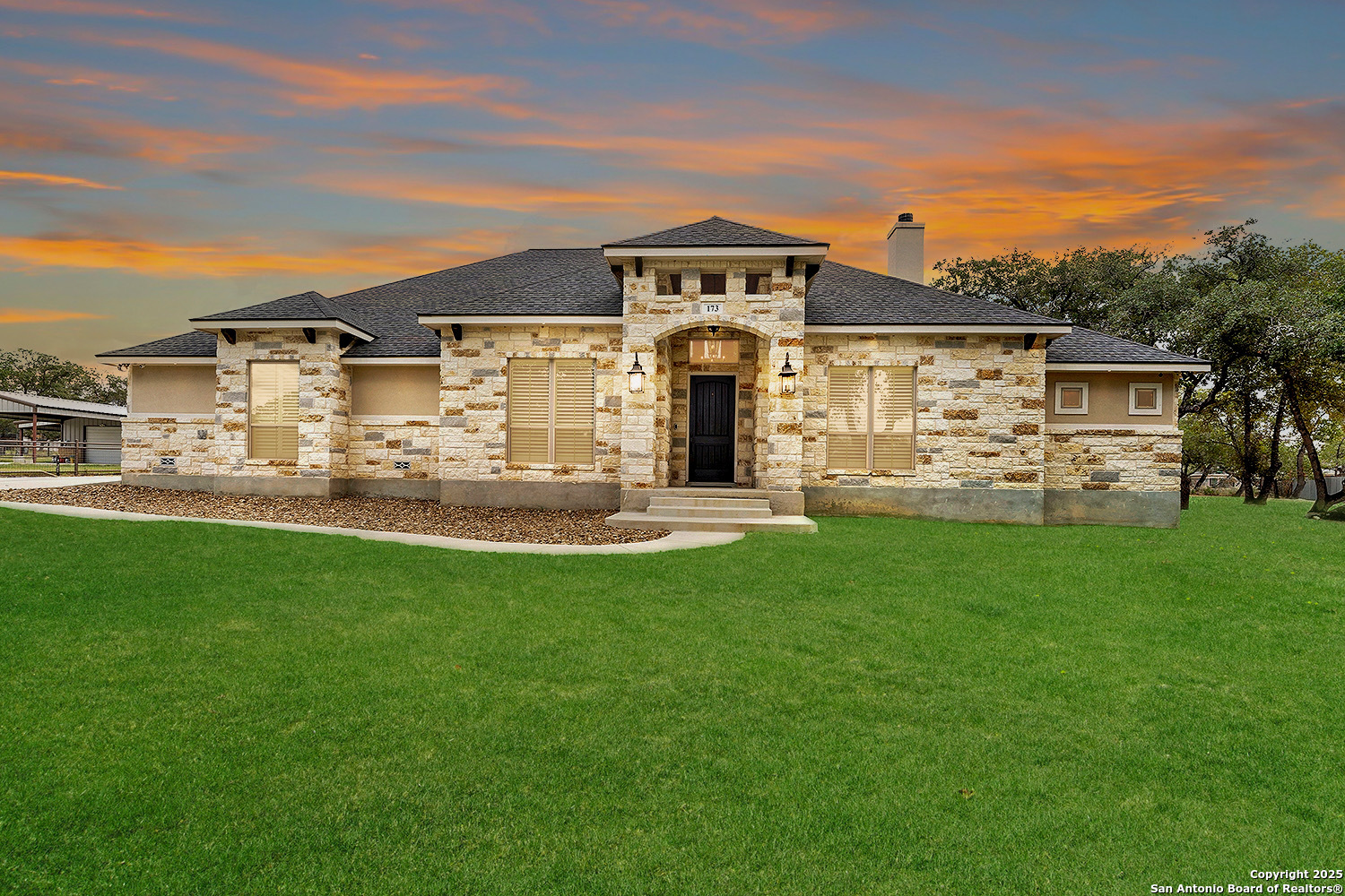 173 Hidden Pond Adkins, TX 78101 - Photo 4 of 40 a front view of a house with a yard