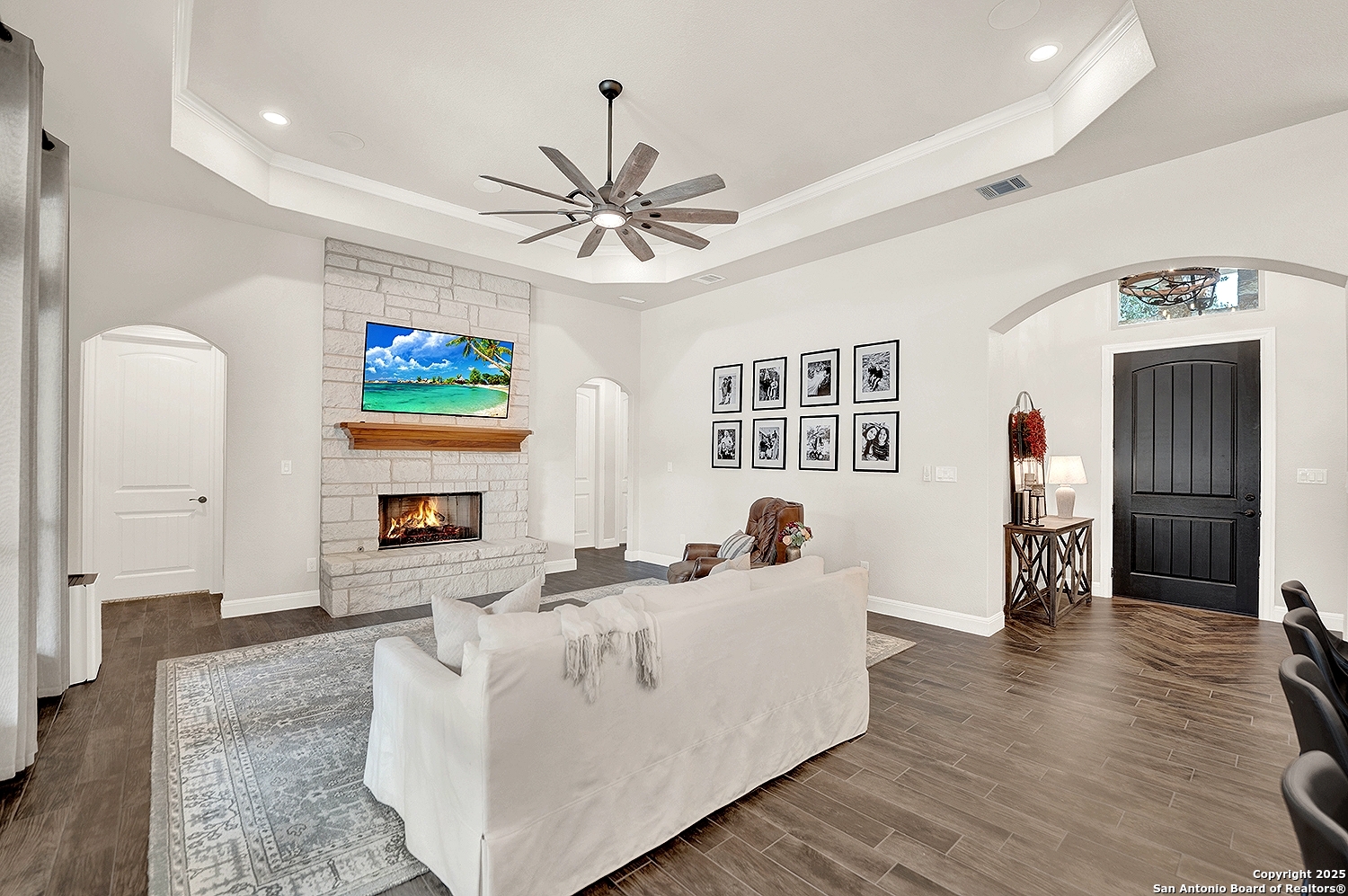 173 Hidden Pond Adkins, TX 78101 - Photo 7 of 40 a living room with fireplace furniture and a flat screen tv