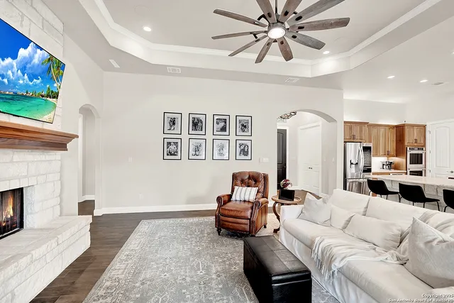 a living room with furniture and a fireplace