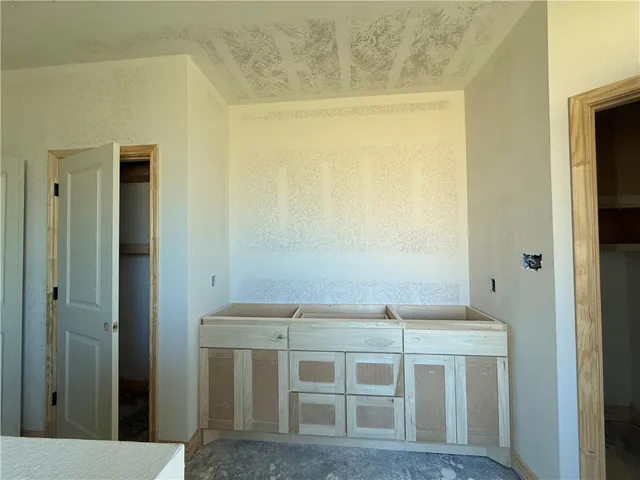 a view of two chairs and table in a yard