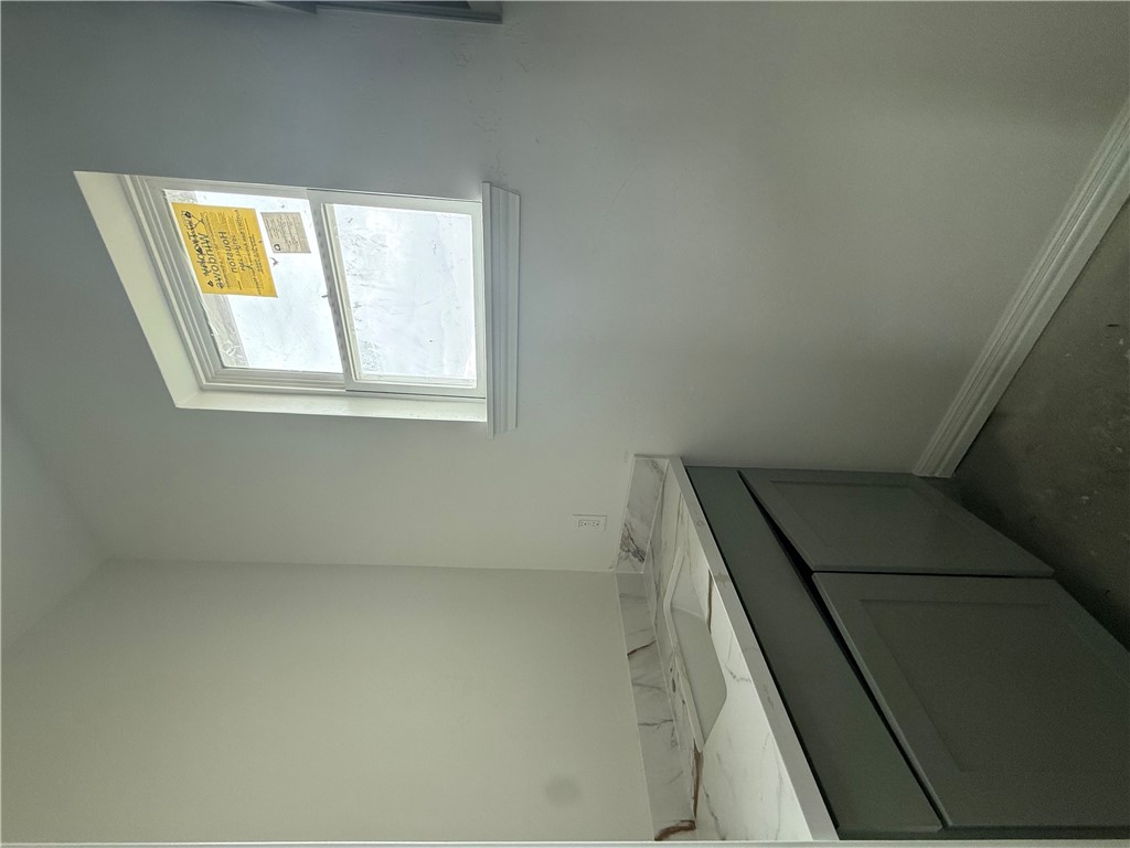 3245 Hunters Crossing Bryan, TX 77808 - Photo 21 of 26 a bathroom with a granite countertop sink vanity and a window