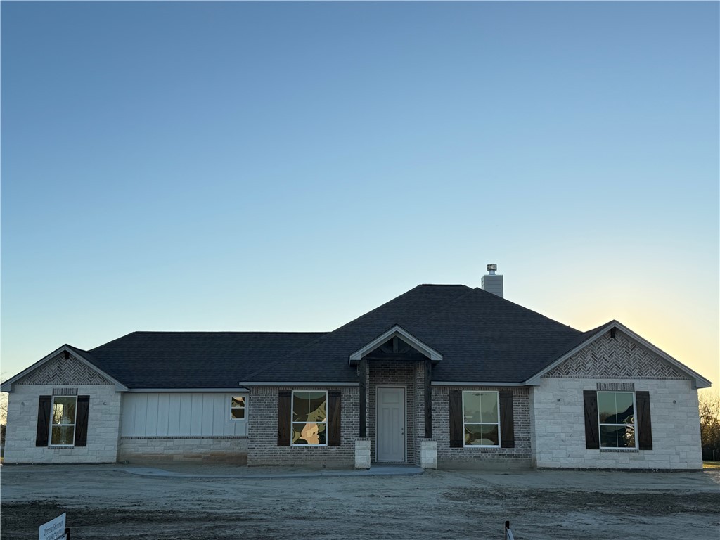 3245 Hunters Crossing Bryan, TX 77808 - Photo 24 of 26 a front view of a house with a yard