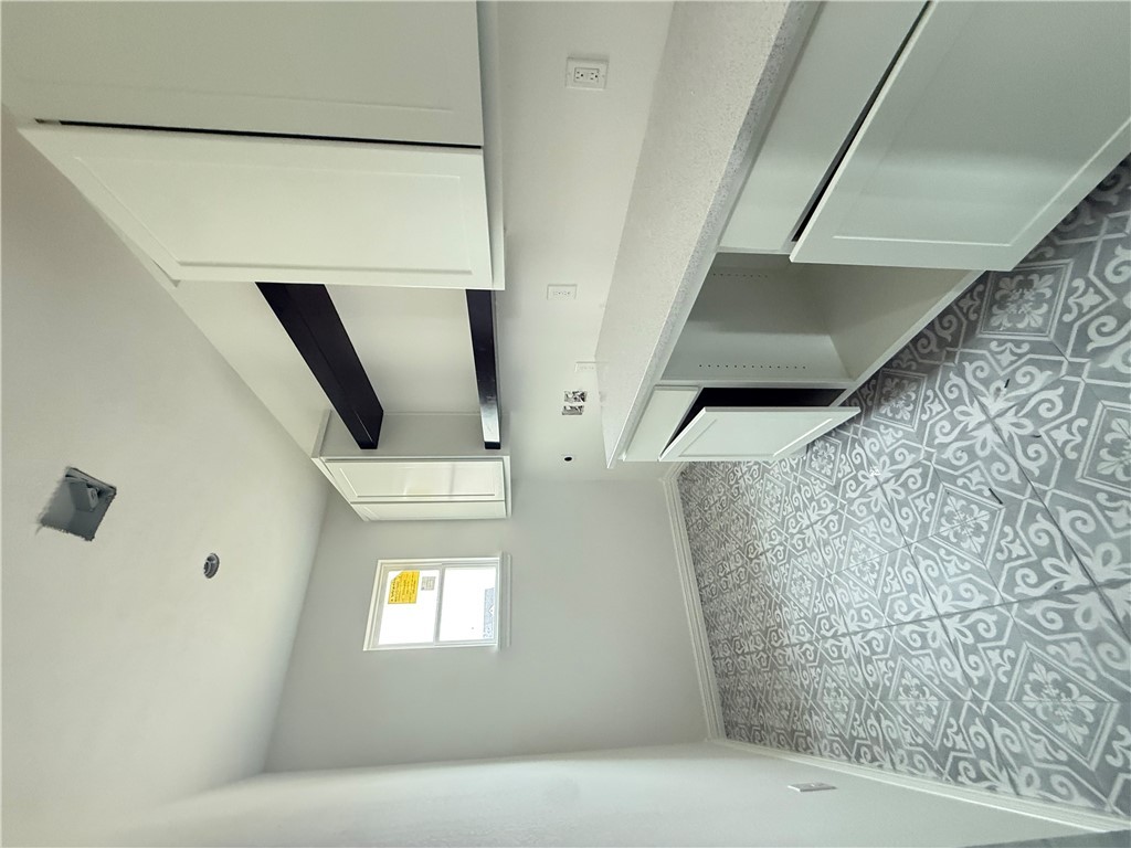 3245 Hunters Crossing Bryan, TX 77808 - Photo 25 of 26 a kitchen with a sink a stove and cabinets